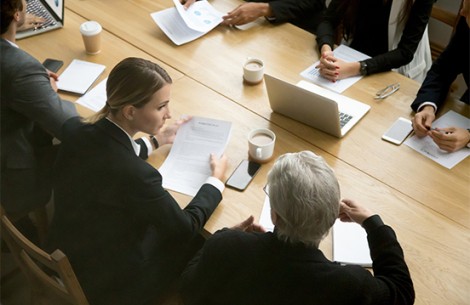 a group of people sitting around a table