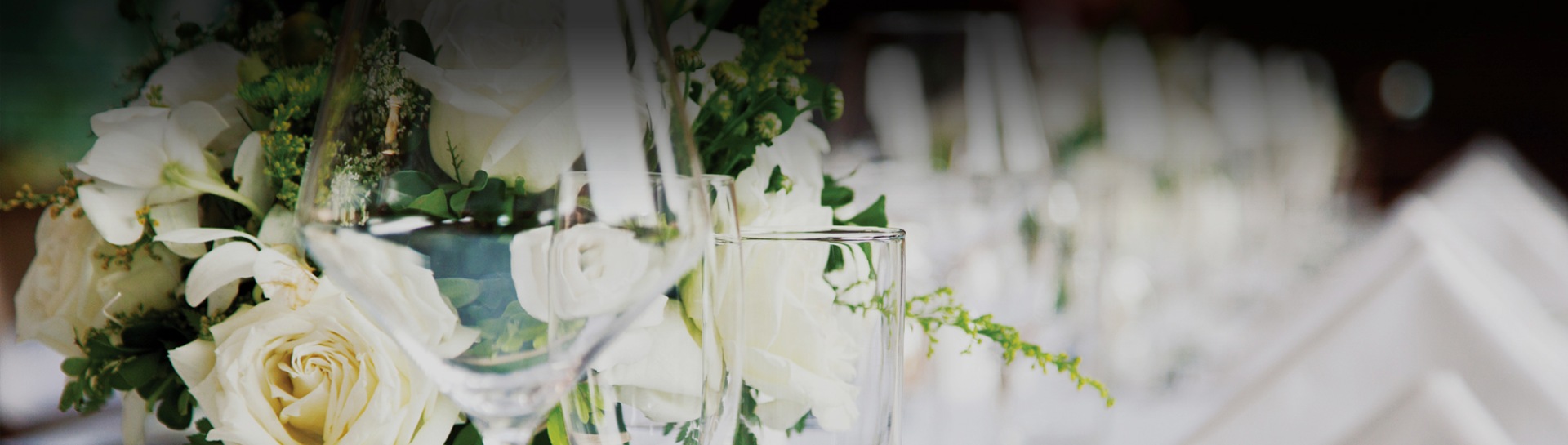 close-up of a glass of wine and flowers