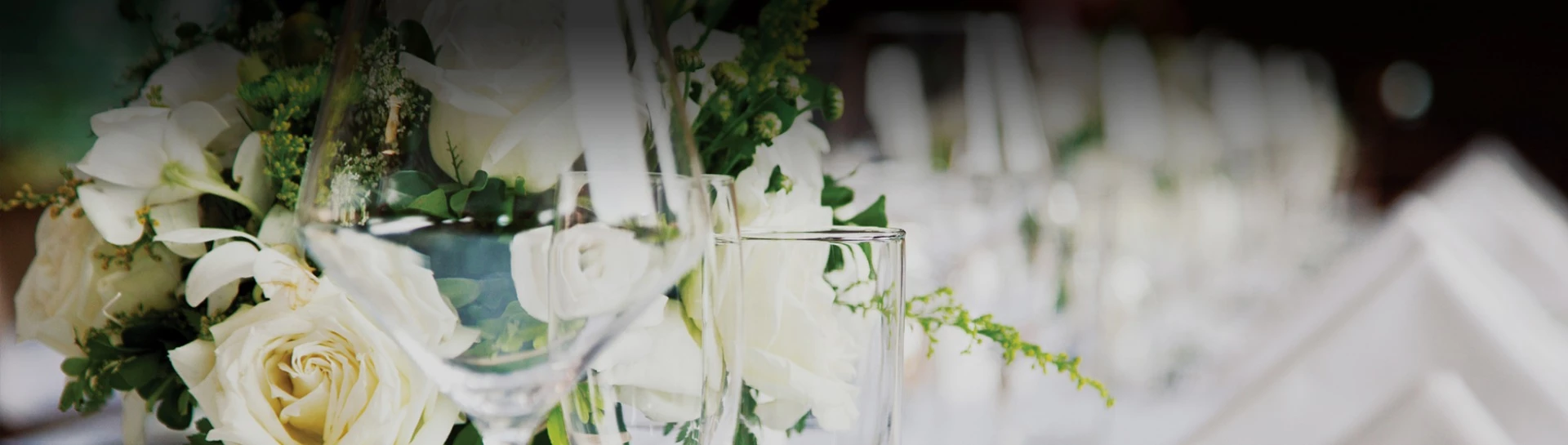 close-up of a glass of wine and flowers