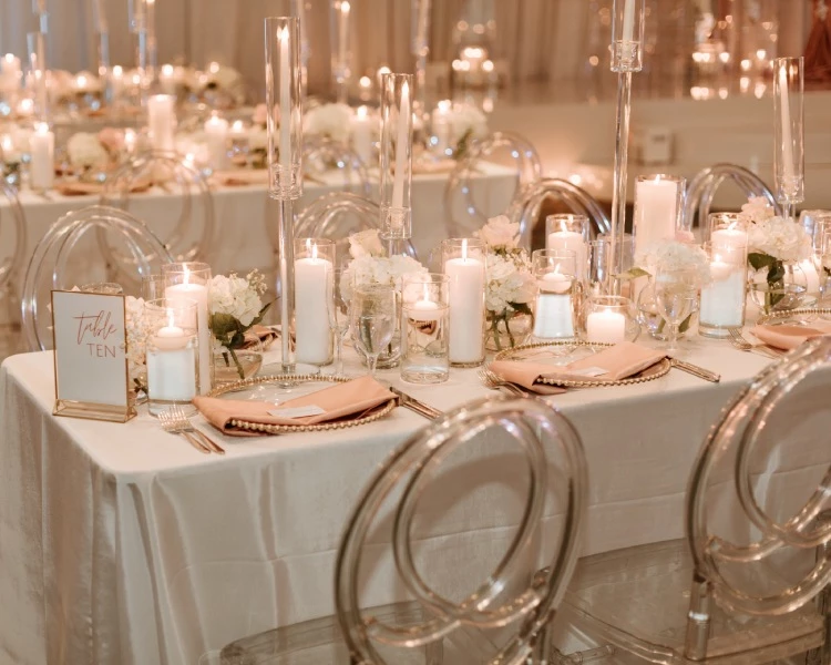 a table set with candles and flowers