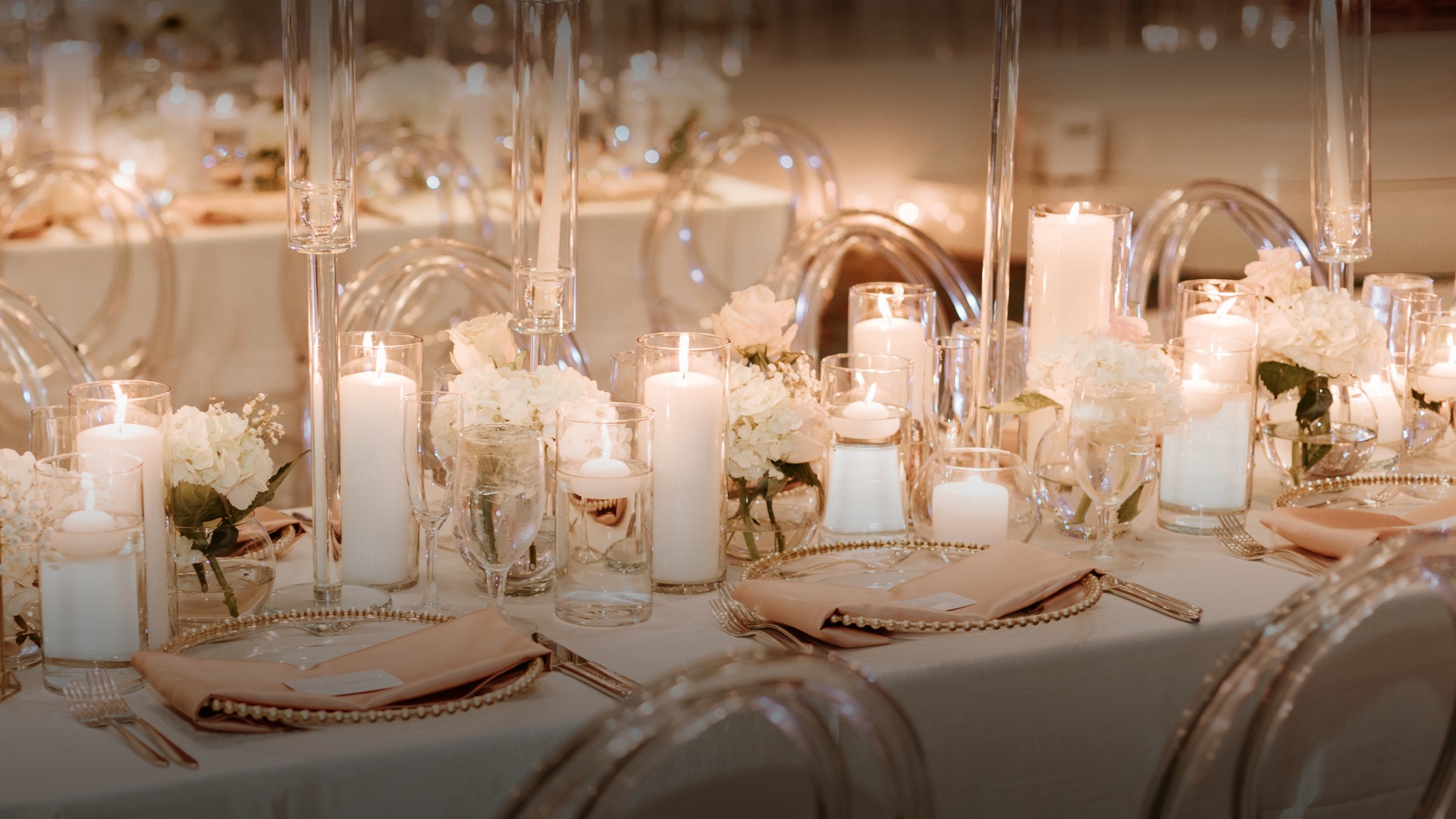 a table with candles and flowers