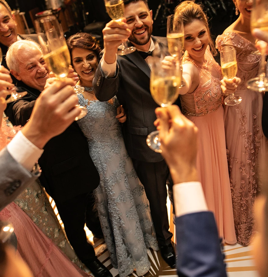 a group of people holding champagne glasses
