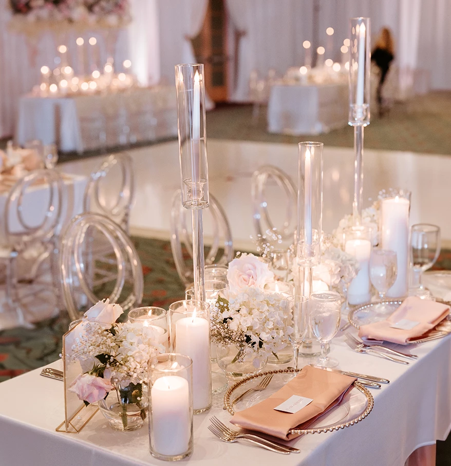 a table set with candles and flowers
