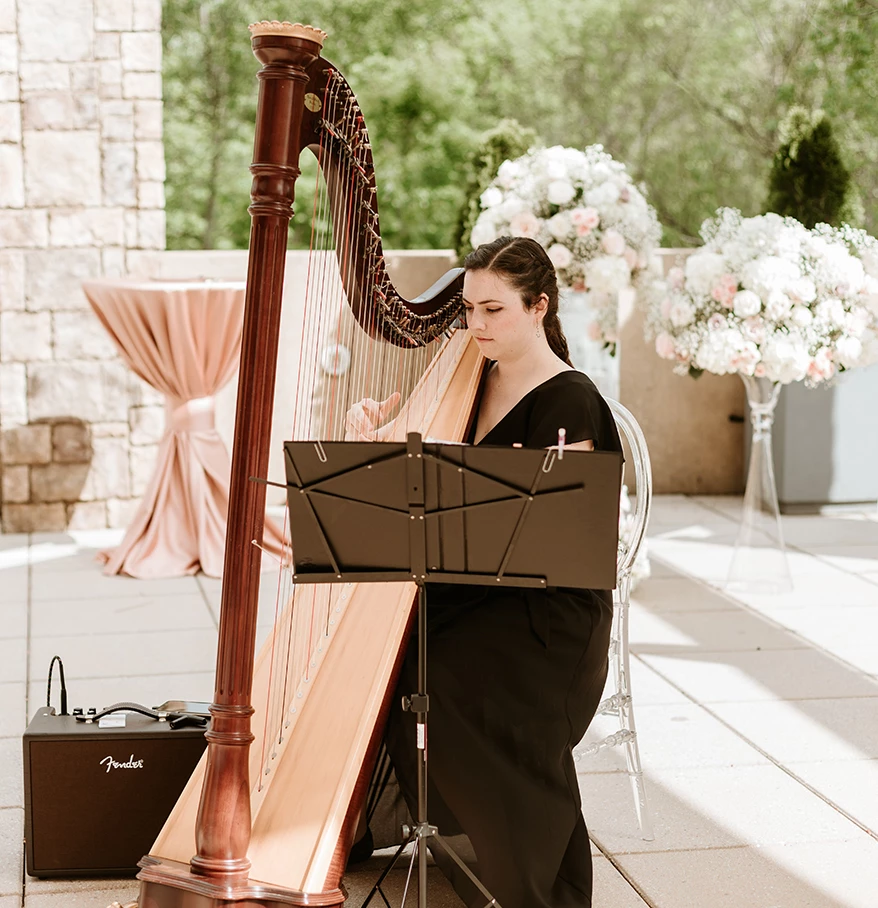 a woman playing a harp
