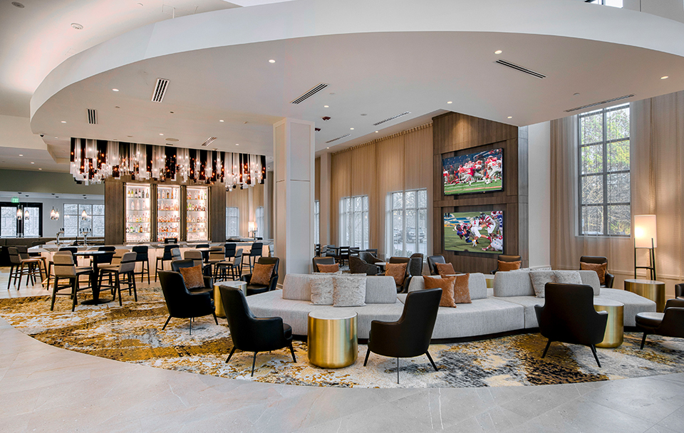 a large lobby with a large couch and chairs