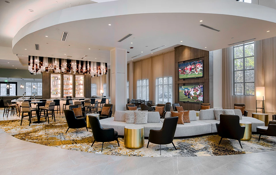 a large lobby with a large couch and chairs