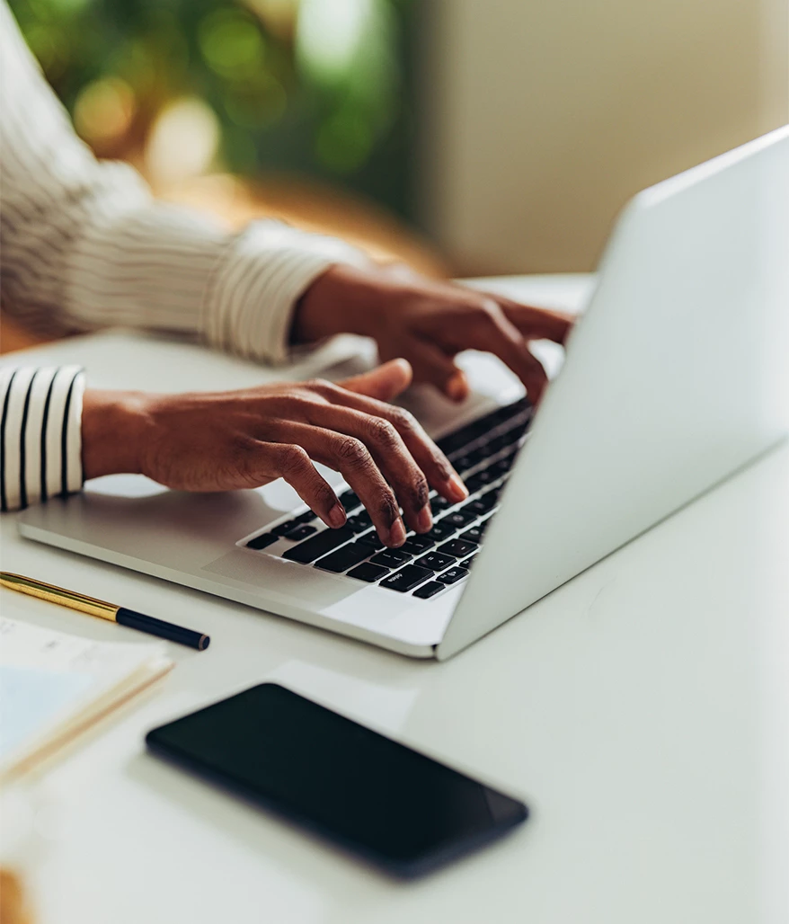 a person typing on a laptop