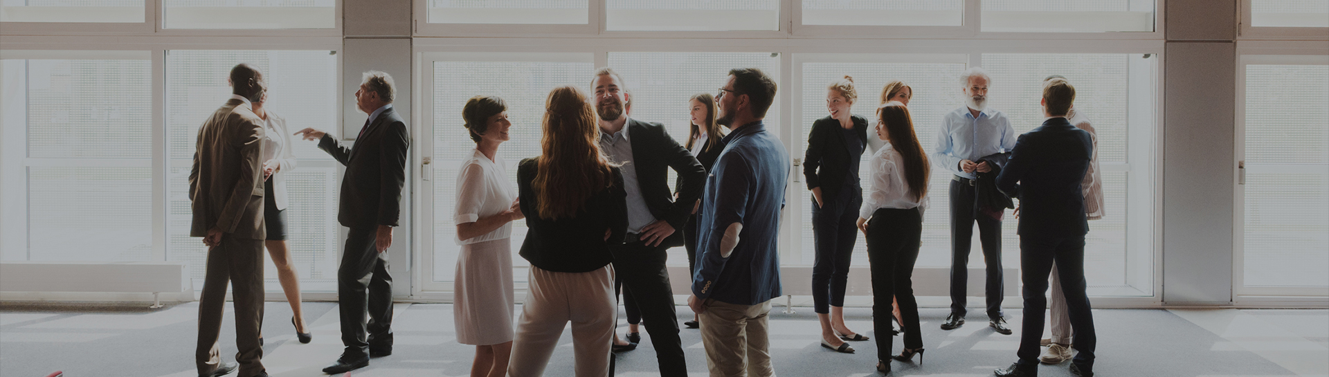 a group of people standing in a room