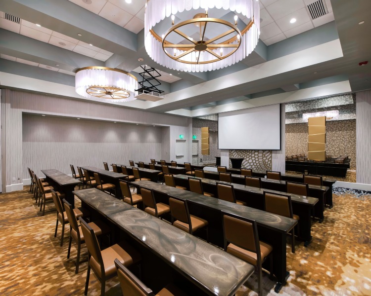 a conference room with tables and chairs