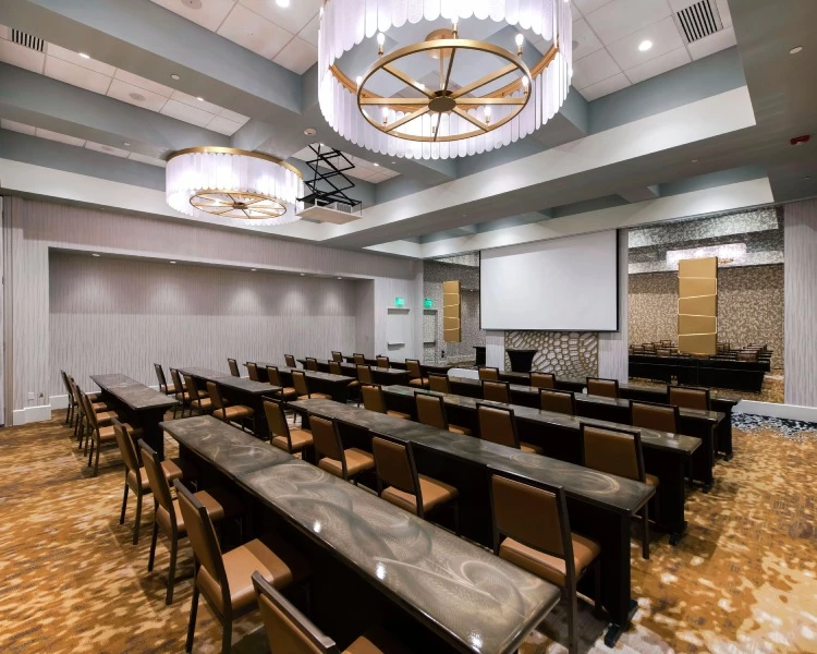 a conference room with tables and chairs