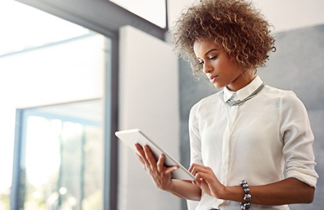 a woman holding a tablet