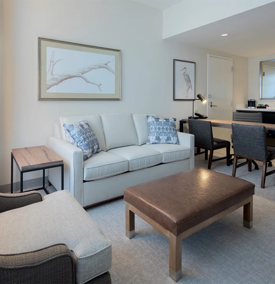 a living room with a couch and chairs