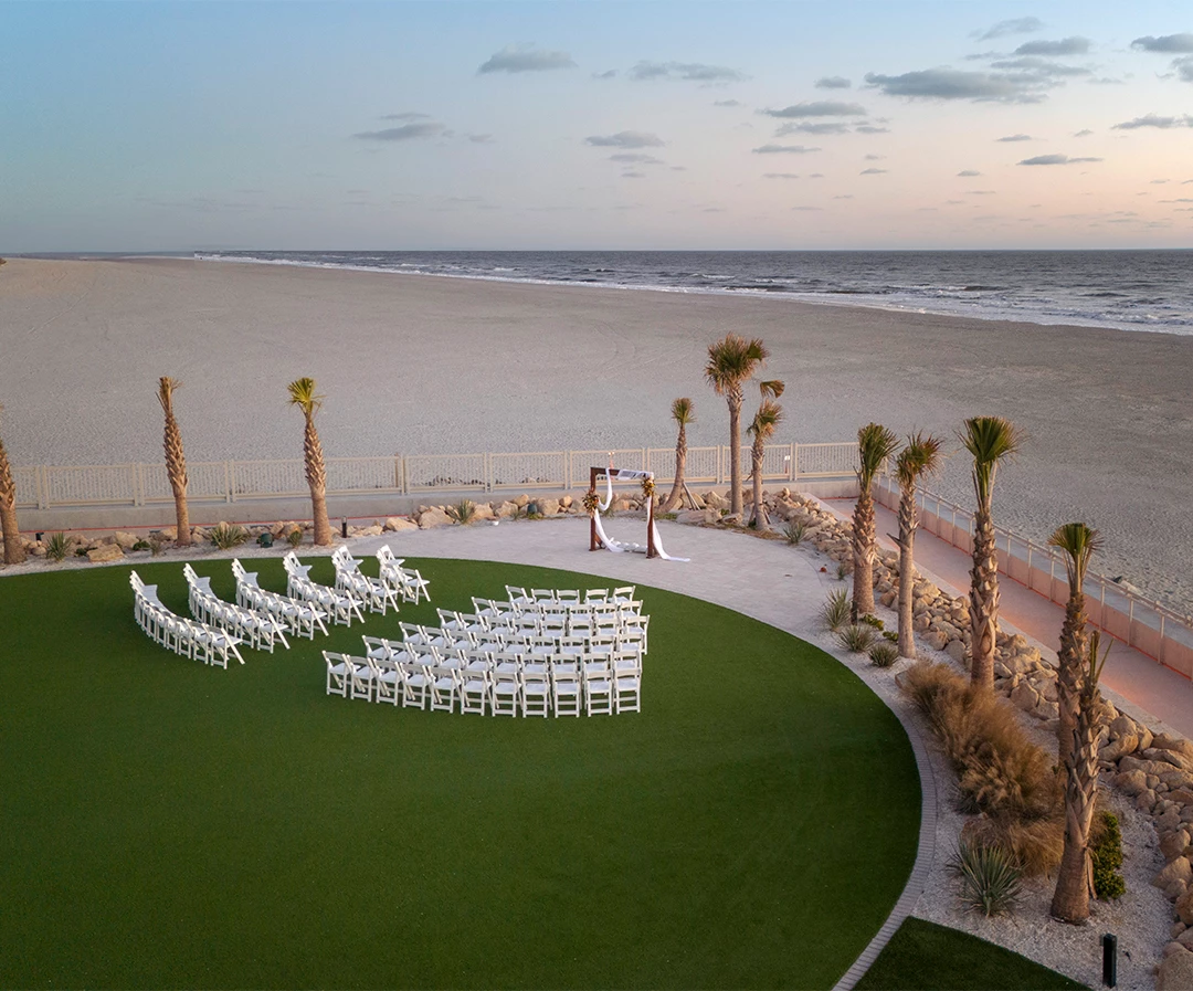 a wedding ceremony set up on a beach