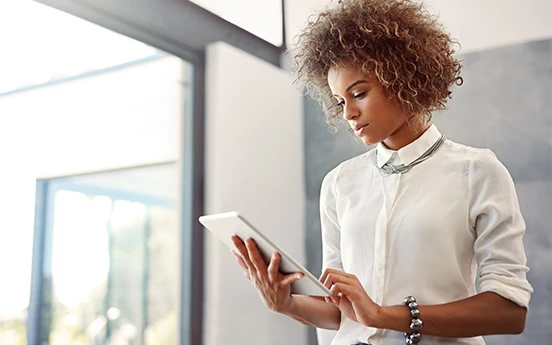 a woman holding a tablet