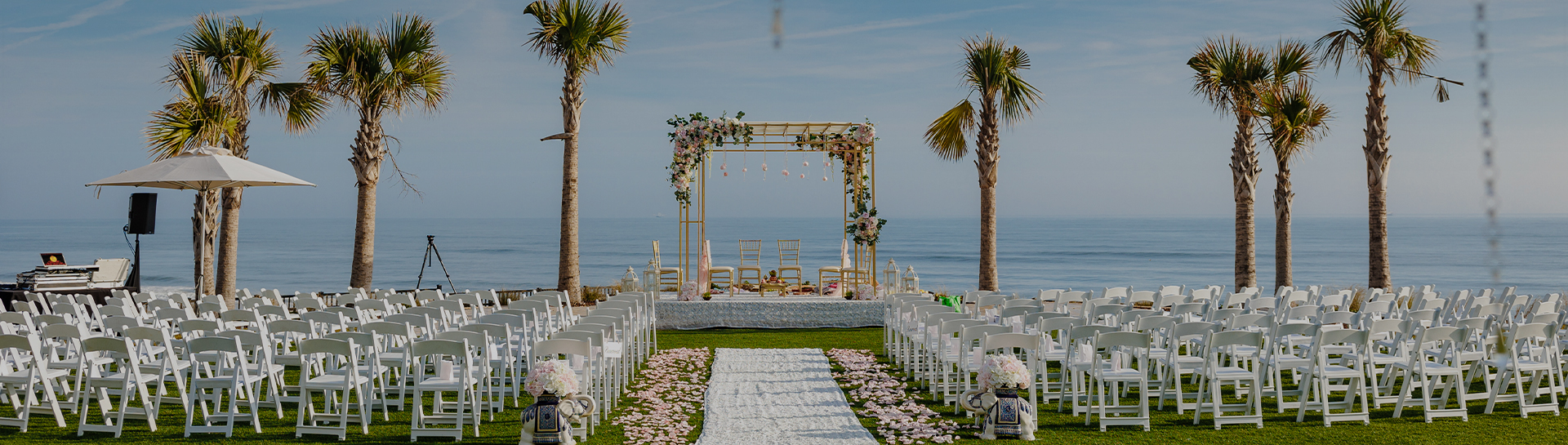 a wedding ceremony set up with chairs and flowers