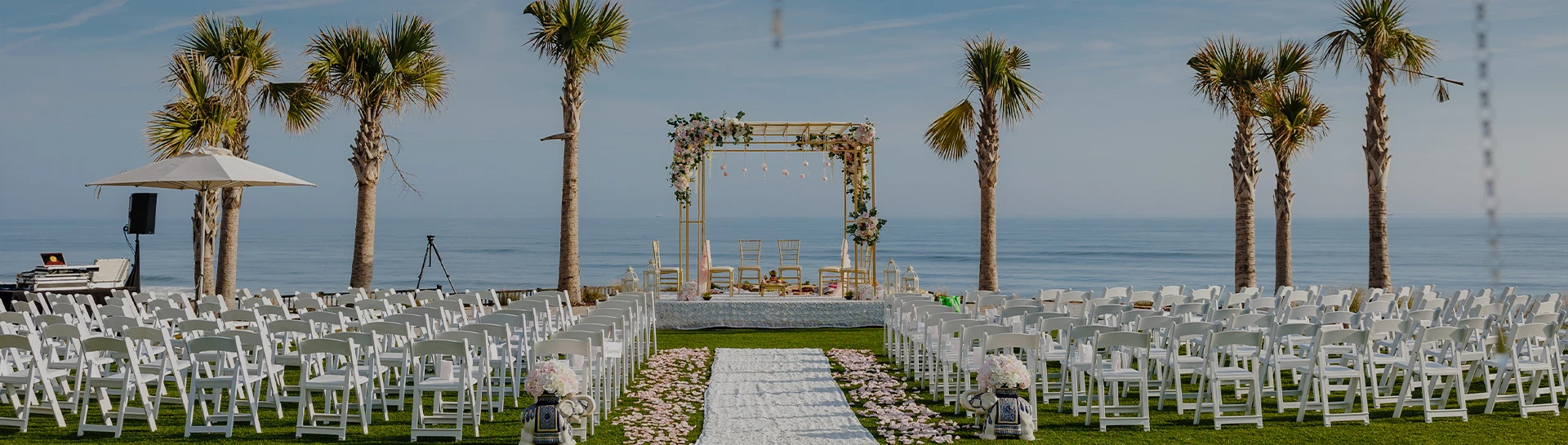 a wedding ceremony set up with chairs and flowers