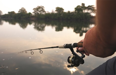 a person fishing on a lake