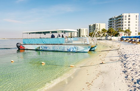a group of people on a boat on a beach