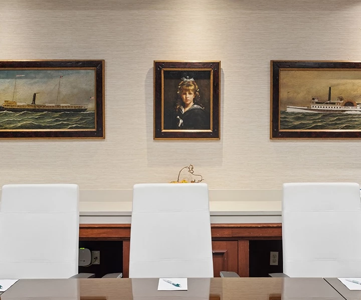 a group of chairs in a room with a table and a table with a table and chairs