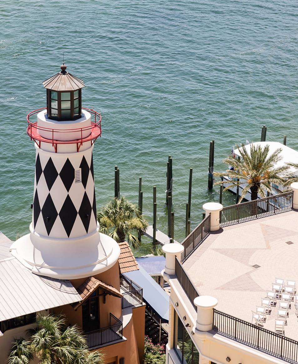 a lighthouse next to a body of water