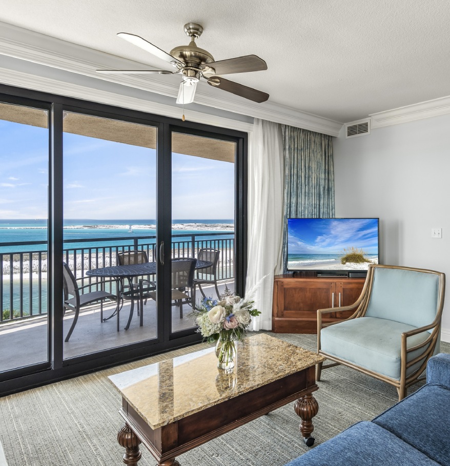a living room with a television and a table