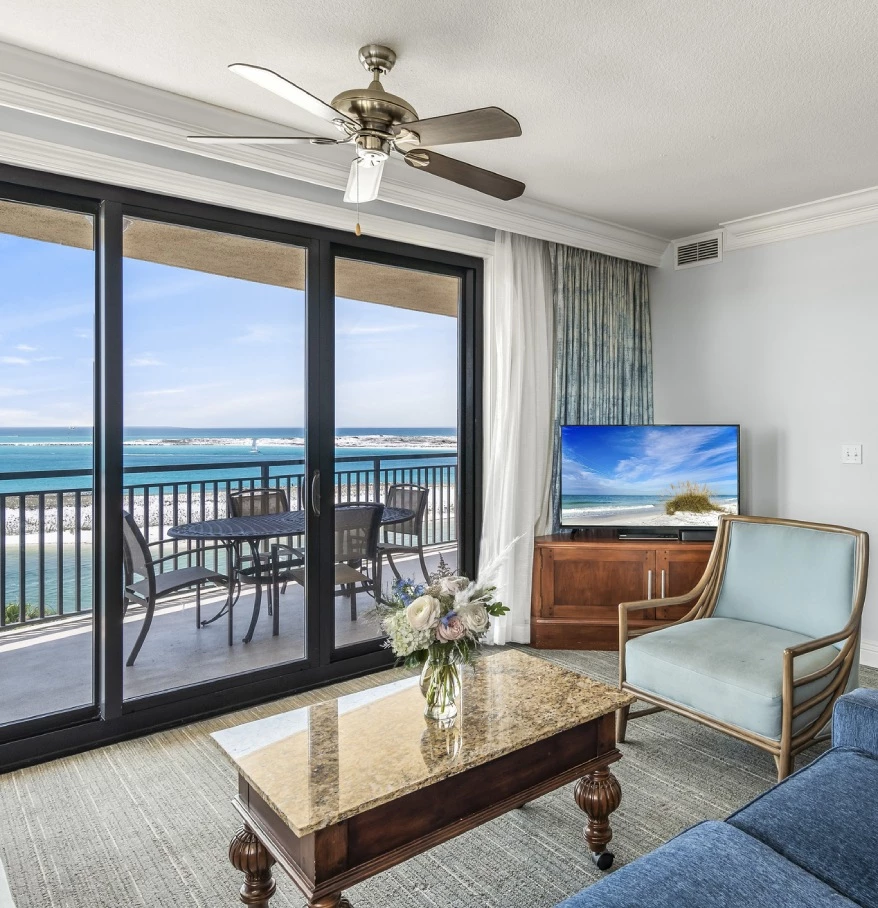 a living room with a television and a table