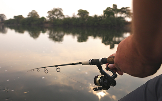 a person fishing on a lake
