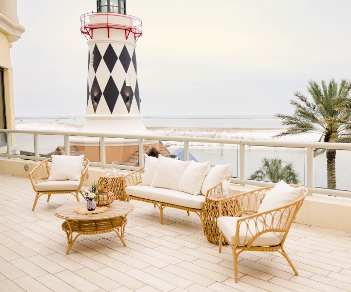 a patio with a white and black lighthouse