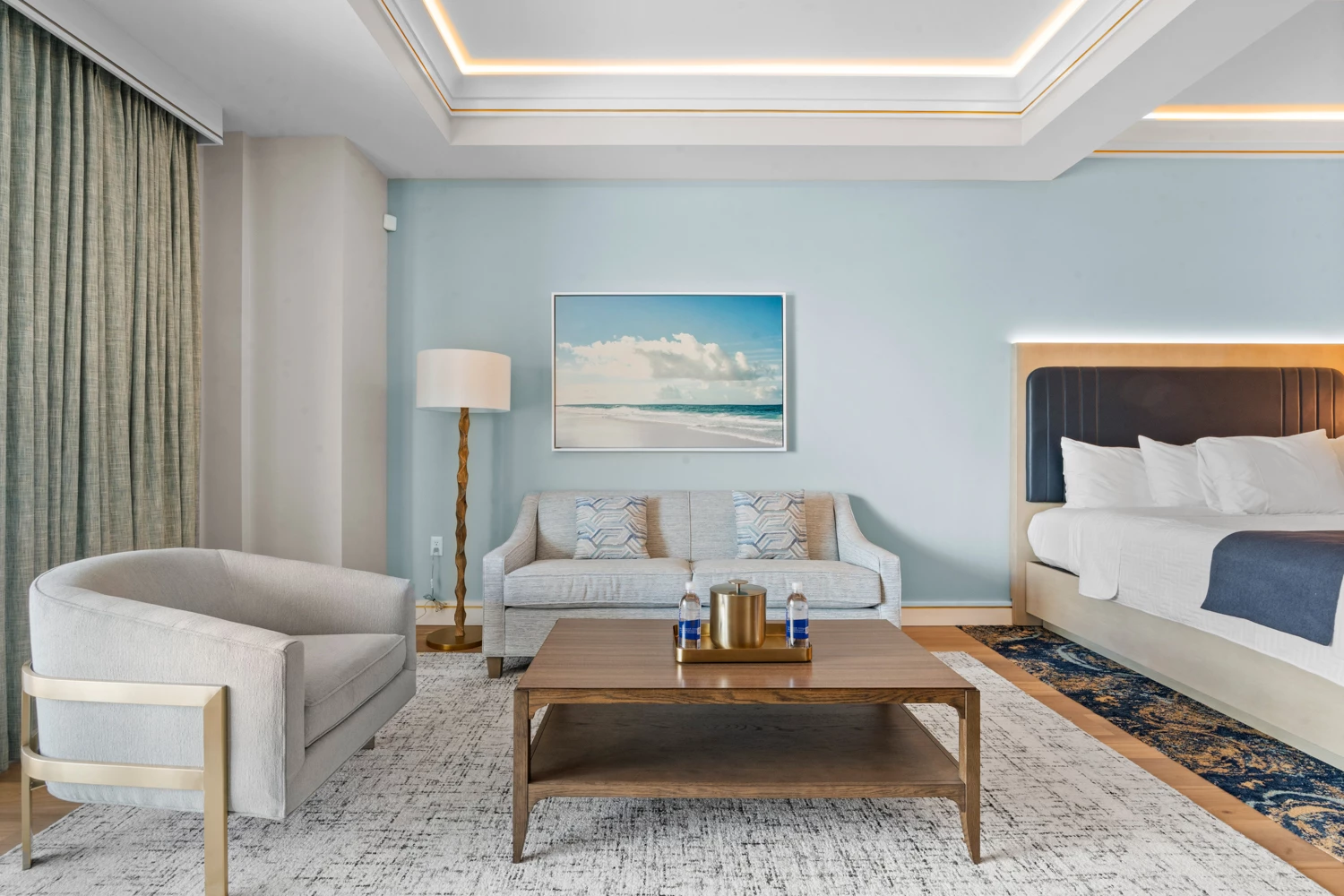 a room with a bed and couches