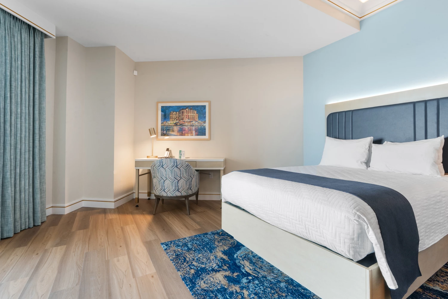 a room with a bed and a desk