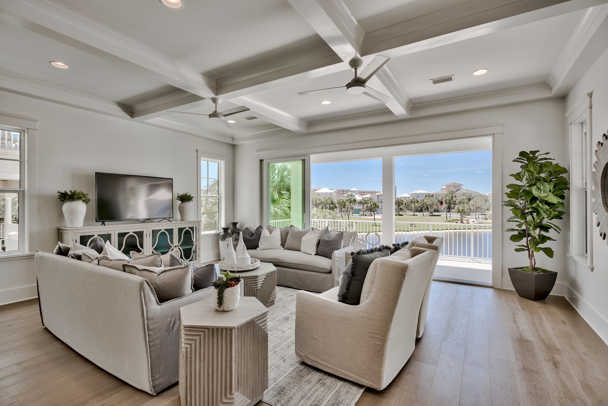 a living room with a large television and couches