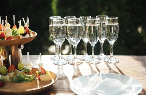 a group of champagne glasses on a table