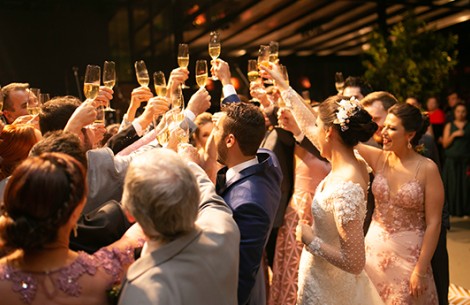 a group of people holding up glasses of champagne