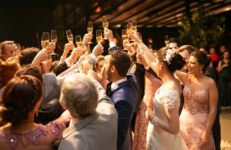 a group of people holding up glasses of champagne