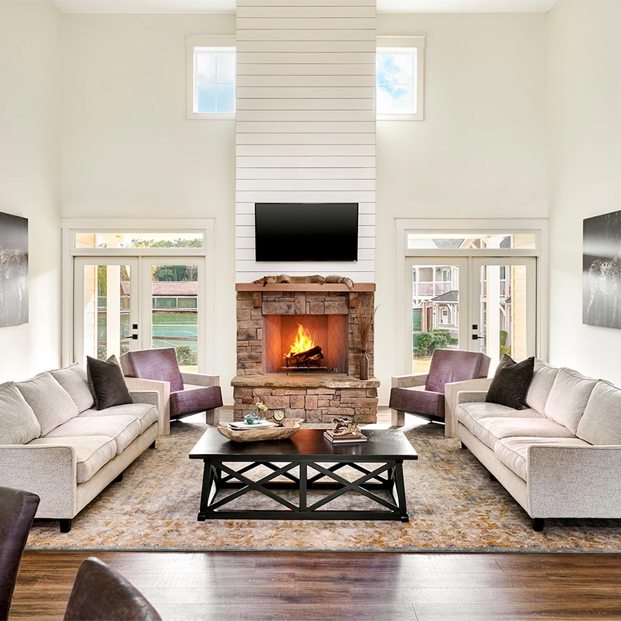 a living room with a fireplace and couches