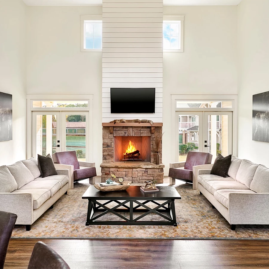 a living room with a fireplace and couches
