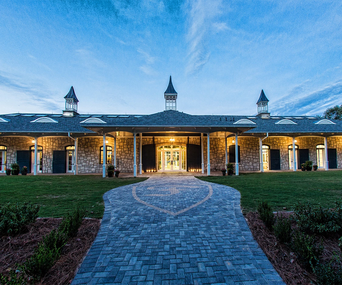 a building with a walkway leading to the entrance