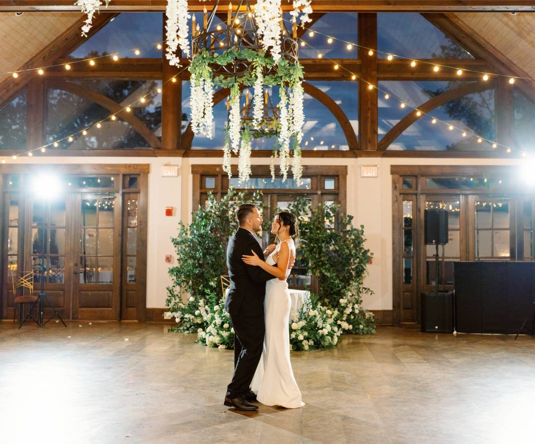 a man and woman kissing in a room