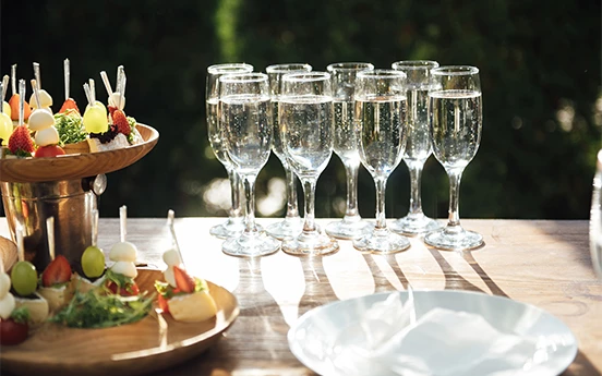 a group of champagne glasses on a table