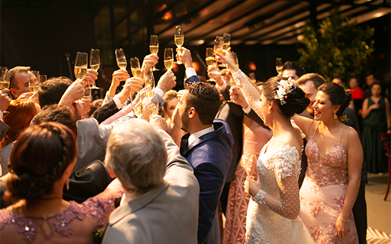 a group of people holding up glasses of champagne