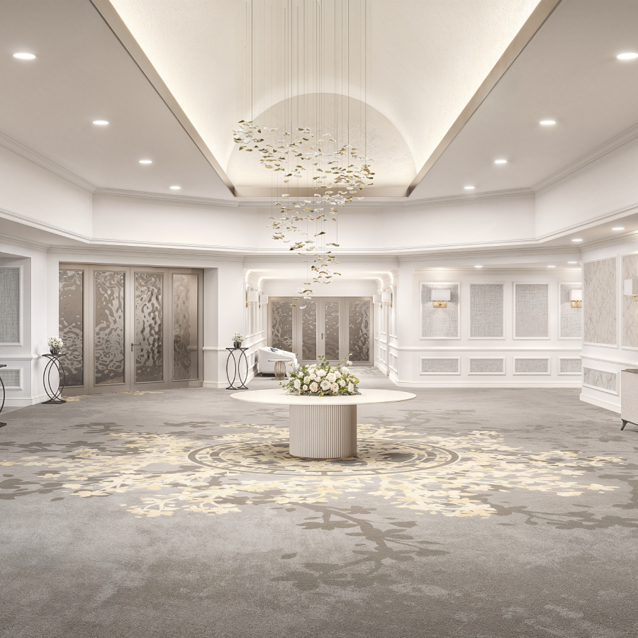 a room with a round table and a chandelier