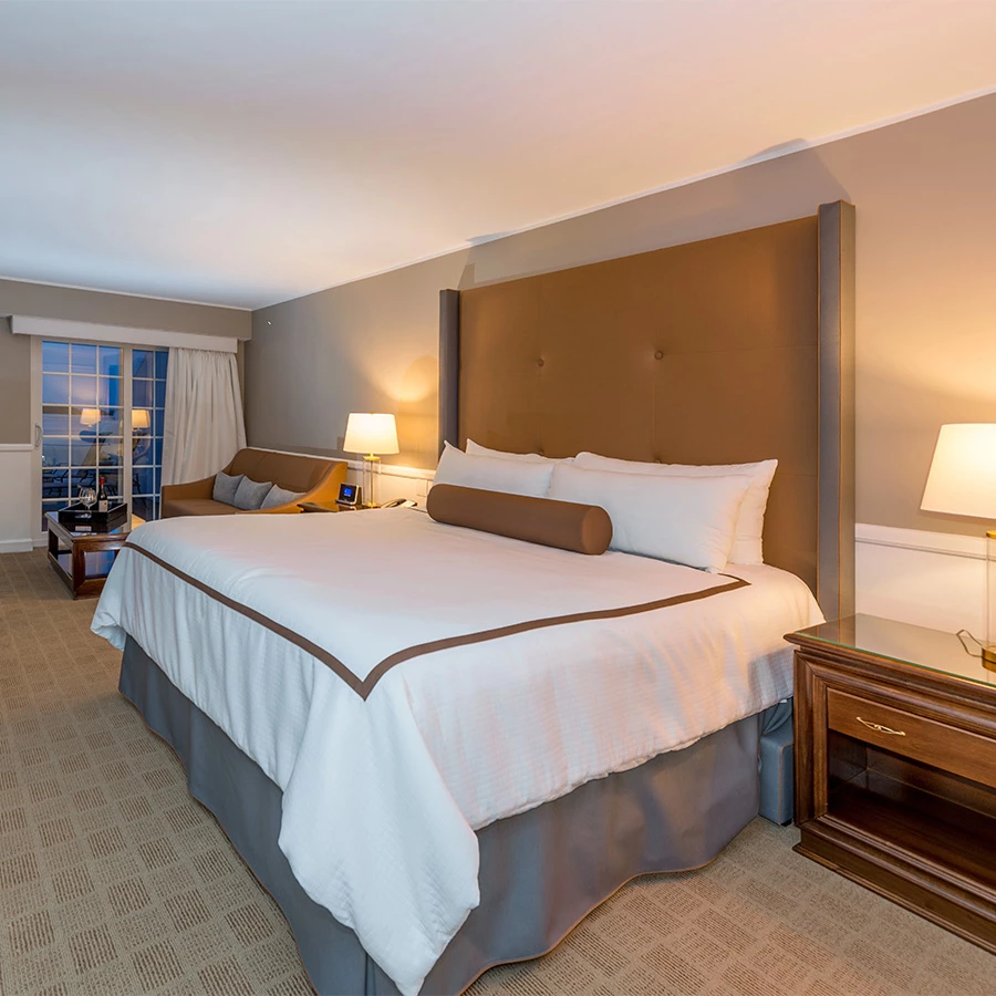 a room with a bed and a nightstand