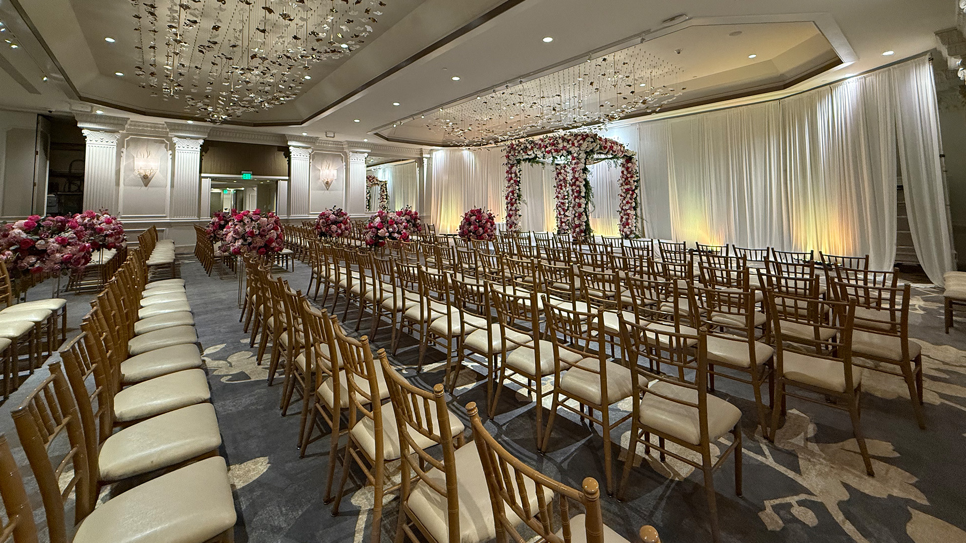 a room with chairs and flowers