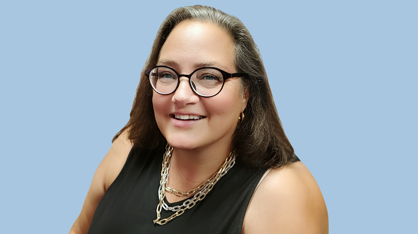 a woman wearing glasses and a black shirt