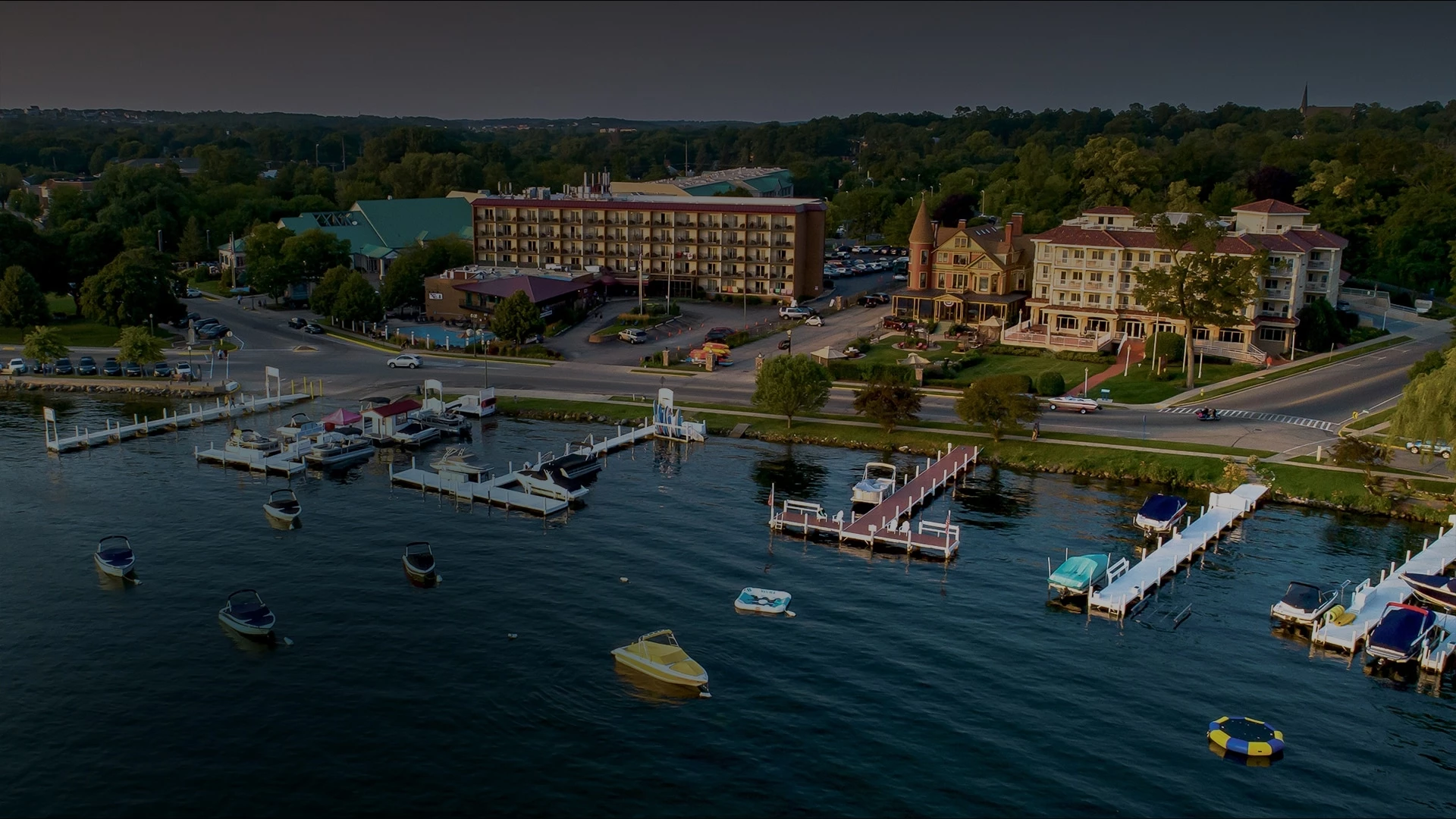 a body of water with boats and buildings in the background