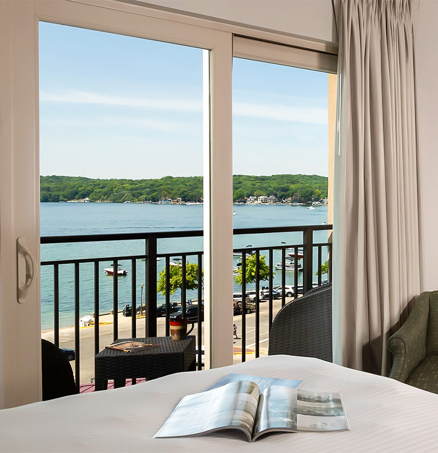 a room with a view of the ocean and a book