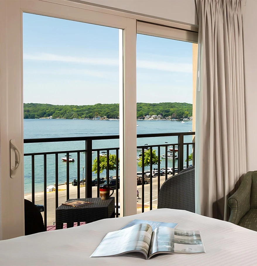 a room with a view of the ocean and a book