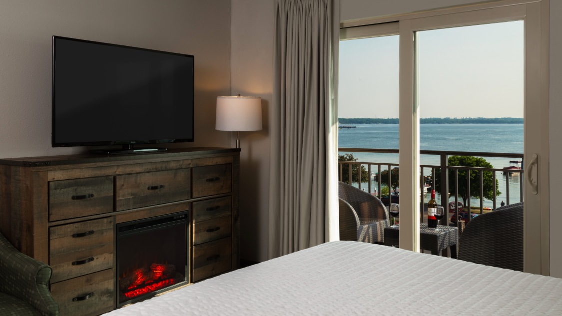 a room with a television and a fireplace