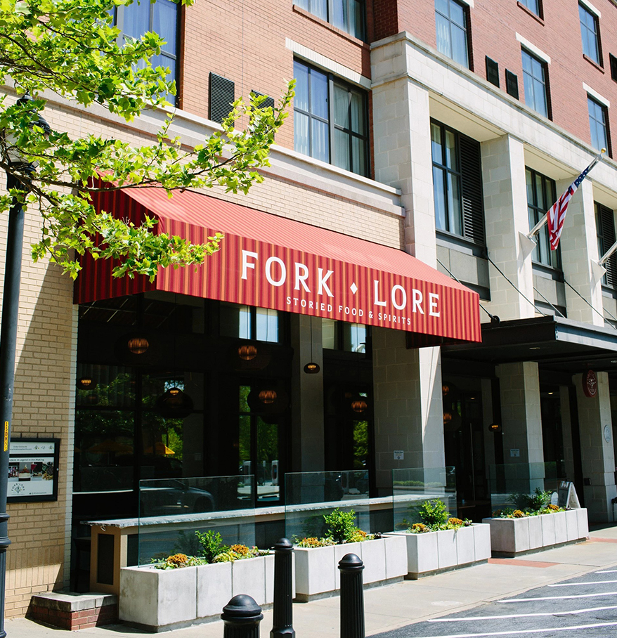 a building with a red awning
