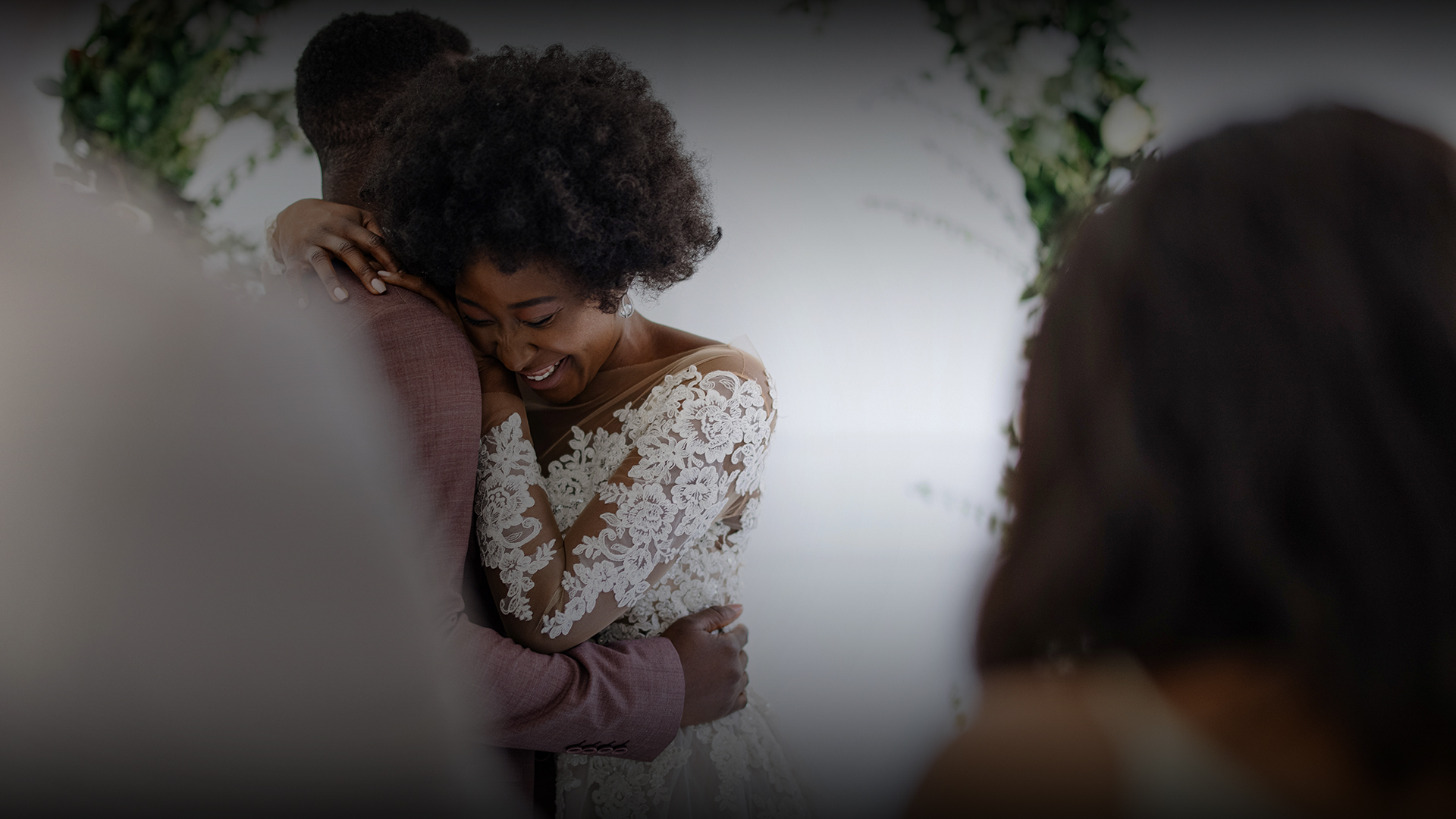 a woman hugging a man